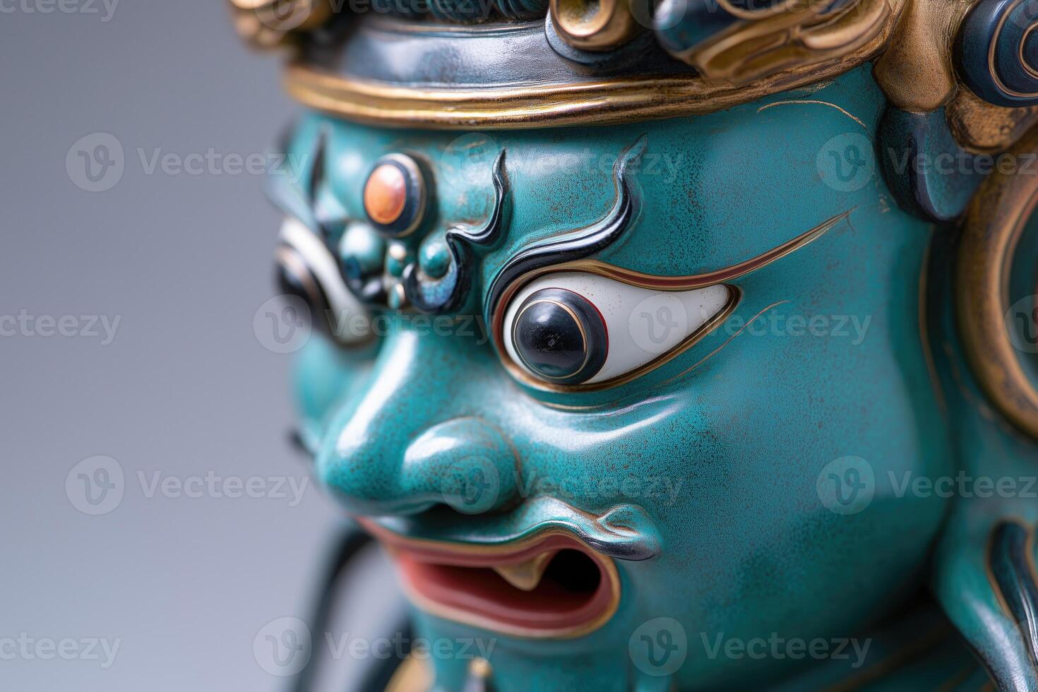 Close up of the face of a oriental deity in traditional style photo