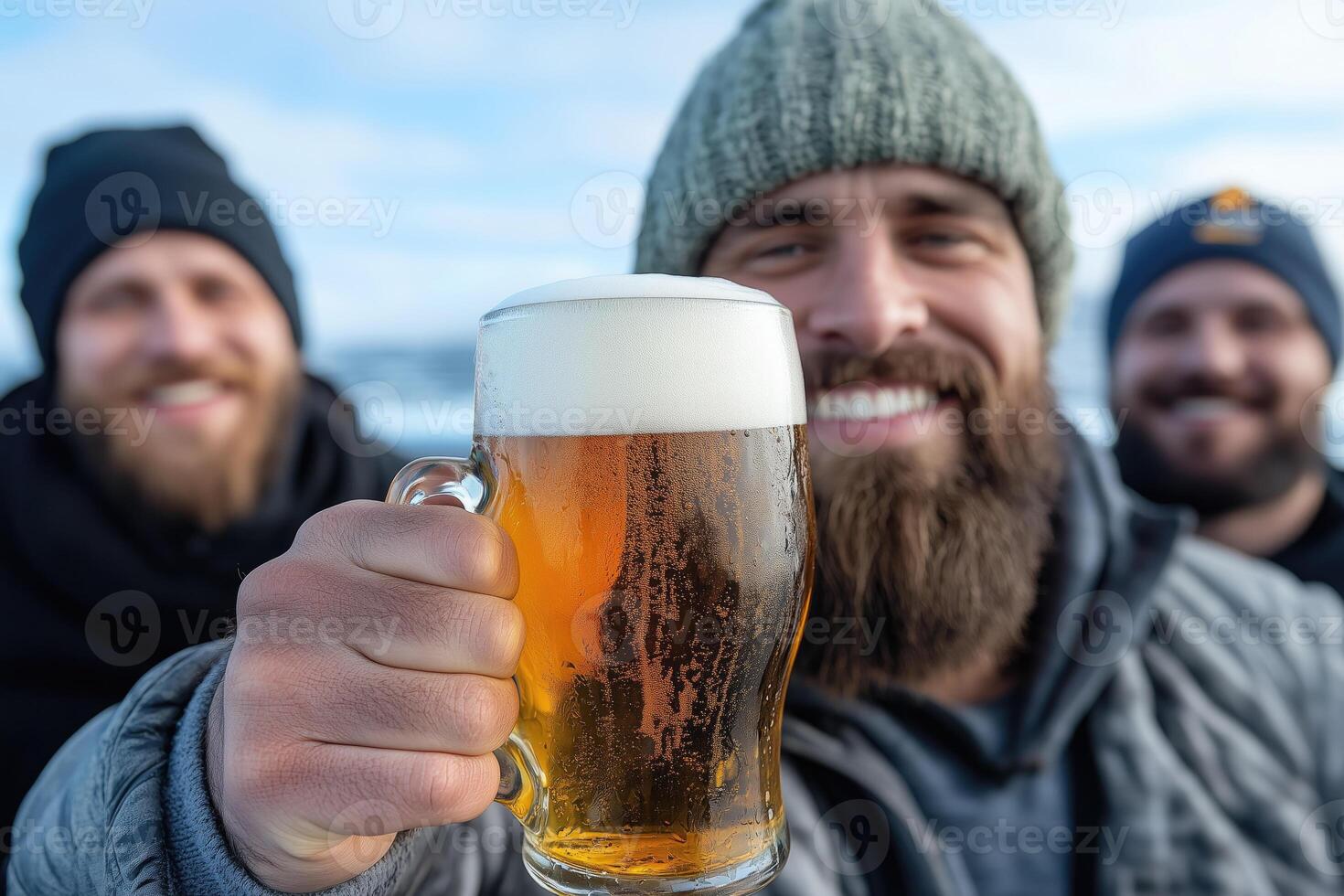 happy friends with beer mugs at cold day, friendship and leisure concept photo