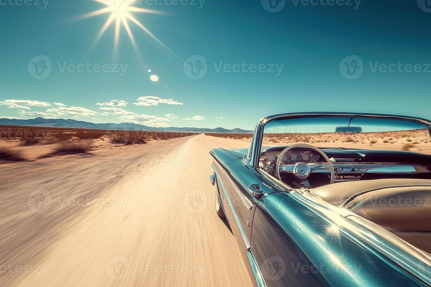 close-up blue vintage retro convertible in hot sandy desert road with bright daylight and clear blue skies photo
