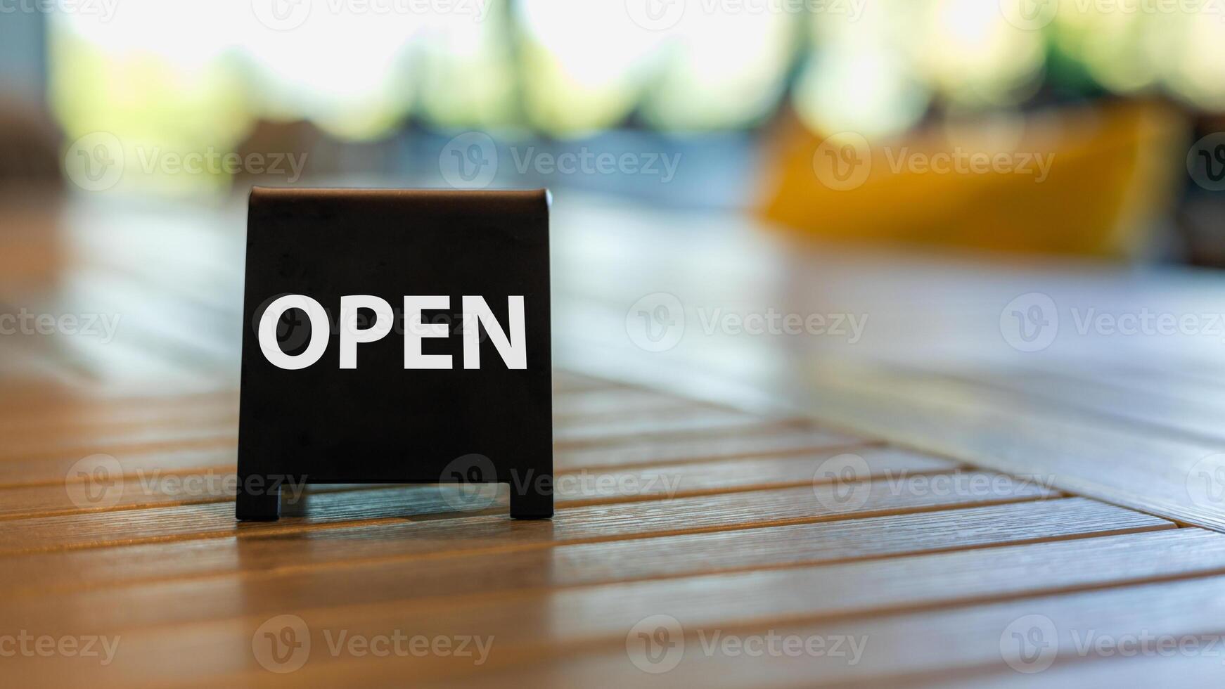 Shop open of storefront sign, restaurant shows the opening status. photo