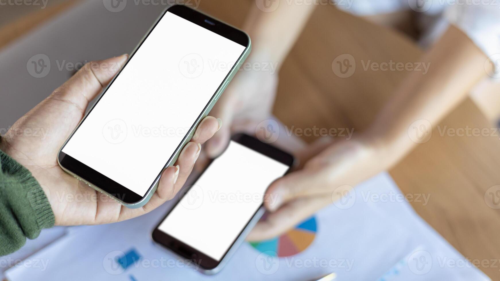 Payment or cashless technology concept, Hand using mobile phone application to scan, Hands holding mobile phone, Coffee shop accepting digital pay without money, Phone screen blank. photo