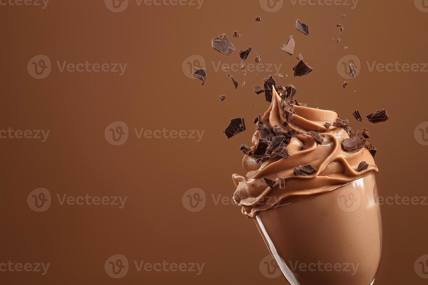 Side view of mocha or chocolate mousse dessert with smooth texture with crushed chocolate pieces in motion, soft brown background. Color trend concept, color of the year 2025. Banner with photo