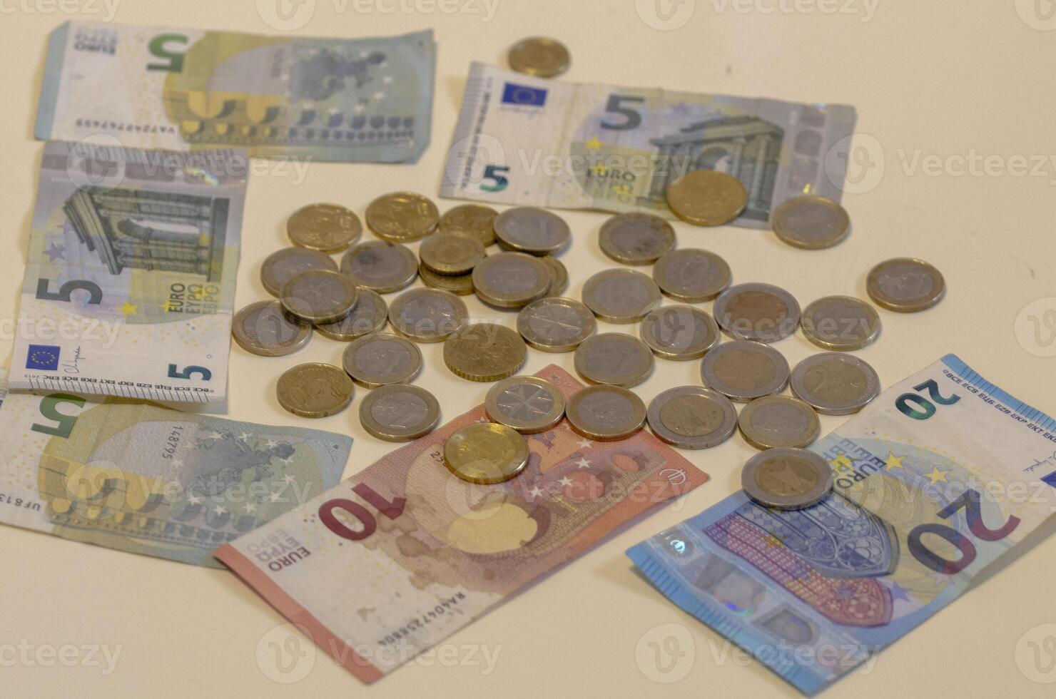 Mixed Euro Currency Banknotes and Coins for Financial Concepts photo