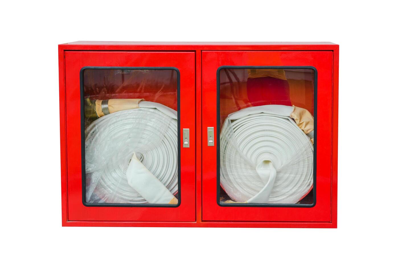 A fire extinguisher is hanging on the wall, ready to combat flames on a white background photo