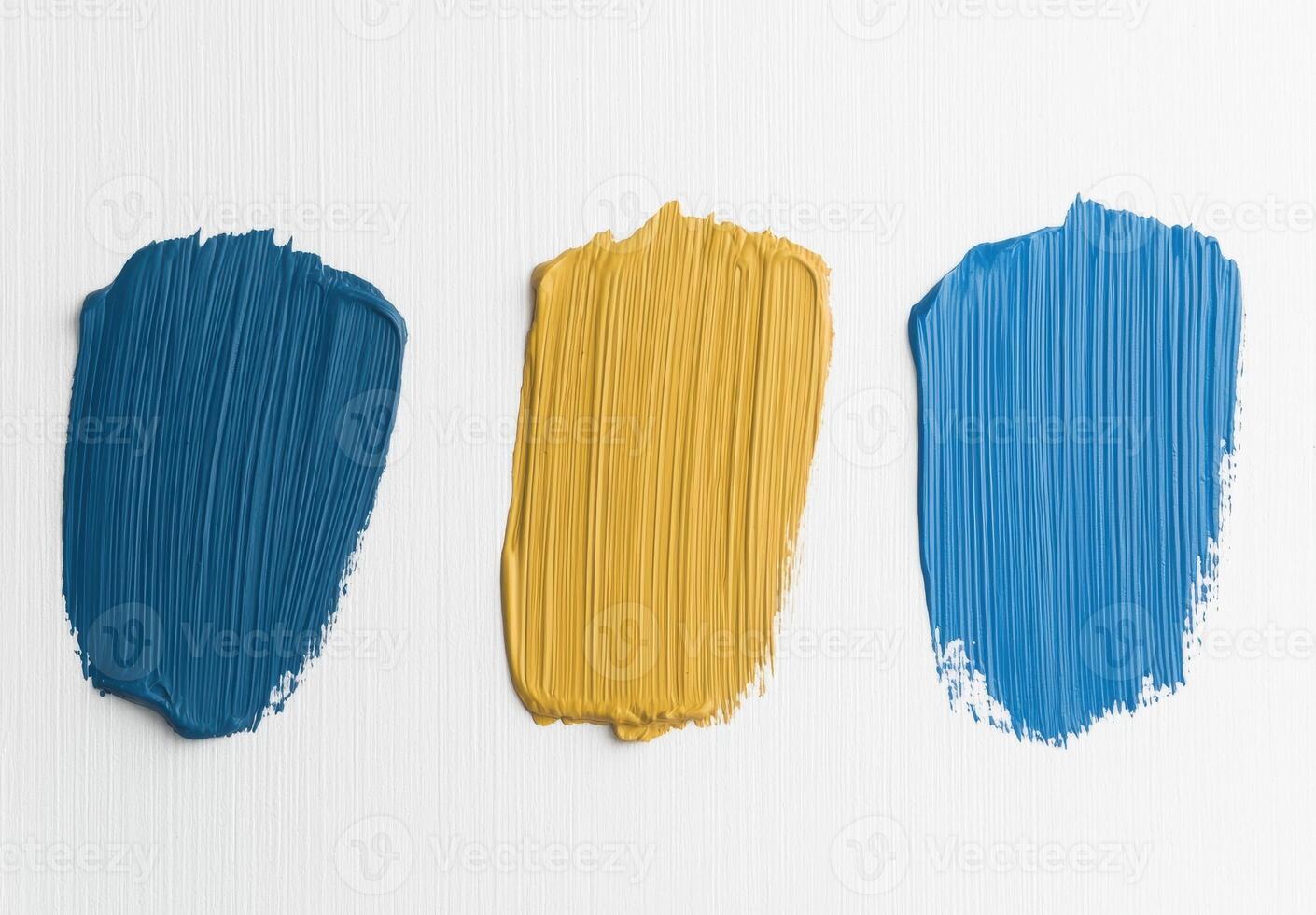 Close up of paint swatches in shades of blue and yellow photo