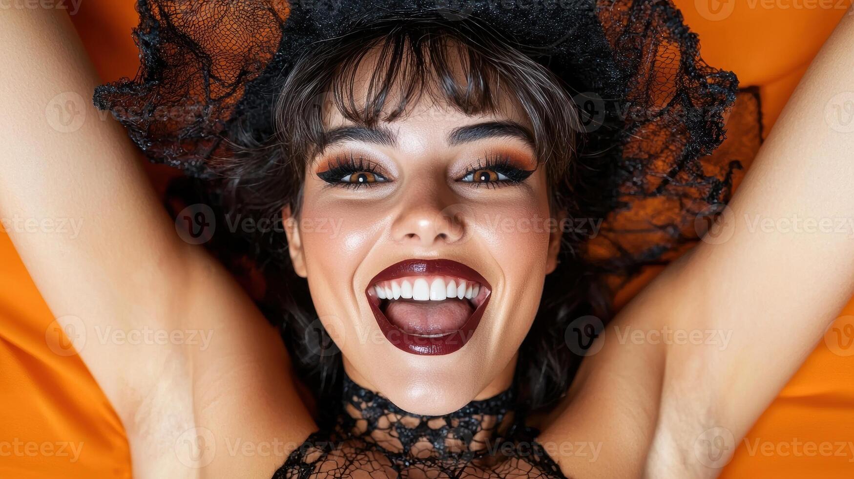 Smiling woman in black lace Halloween costume photo