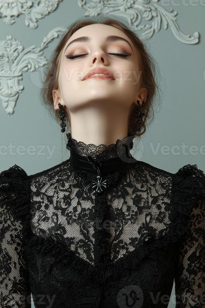 Portrait of a young woman in a black lace dress photo