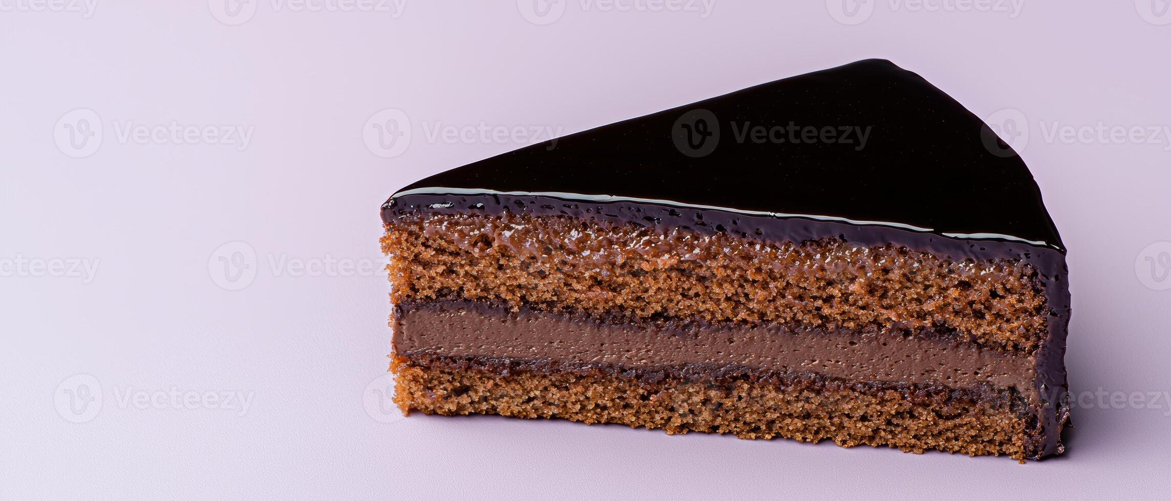 Close up of a delicious chocolate cake slice with ganache topping photo