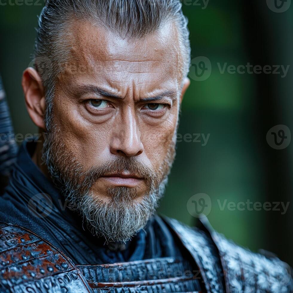 Close up portrait of a serious man with a beard and gray hair photo