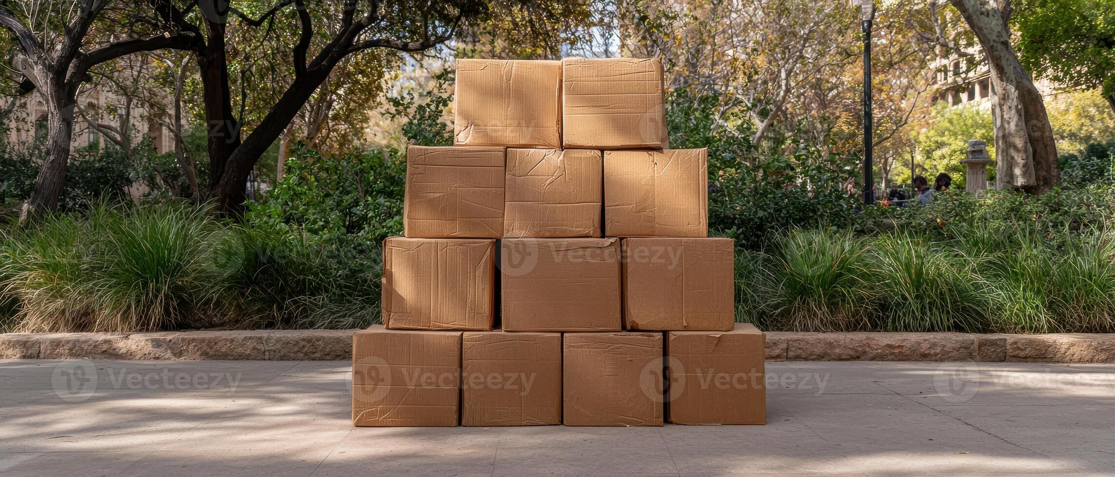 Stack of Cardboard Boxes in a Park Setting photo
