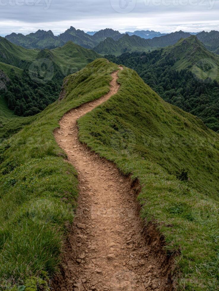 A winding mountain path leads to a scenic overlook photo