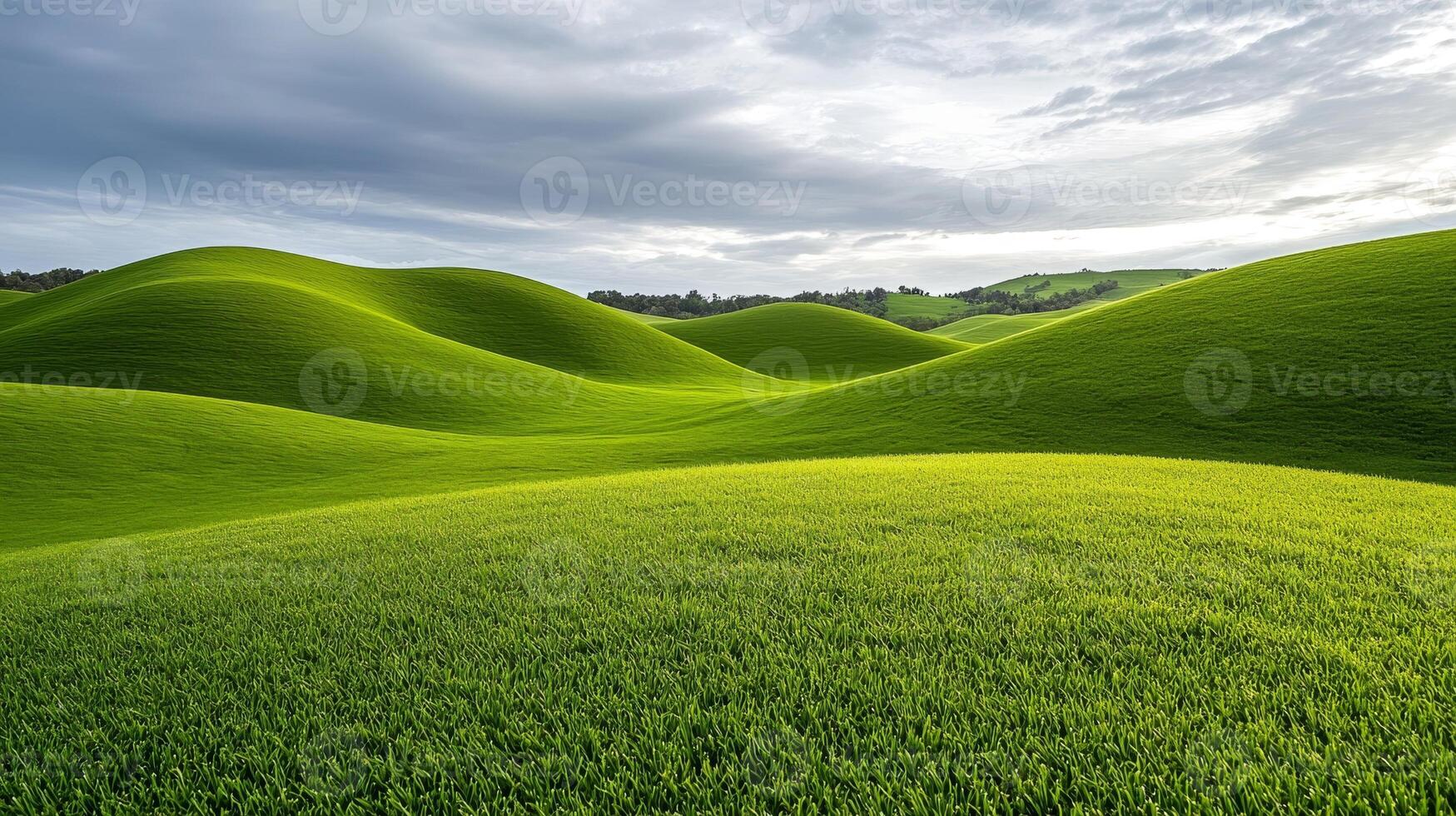 Lush green rolling hills under a cloudy sky. photo