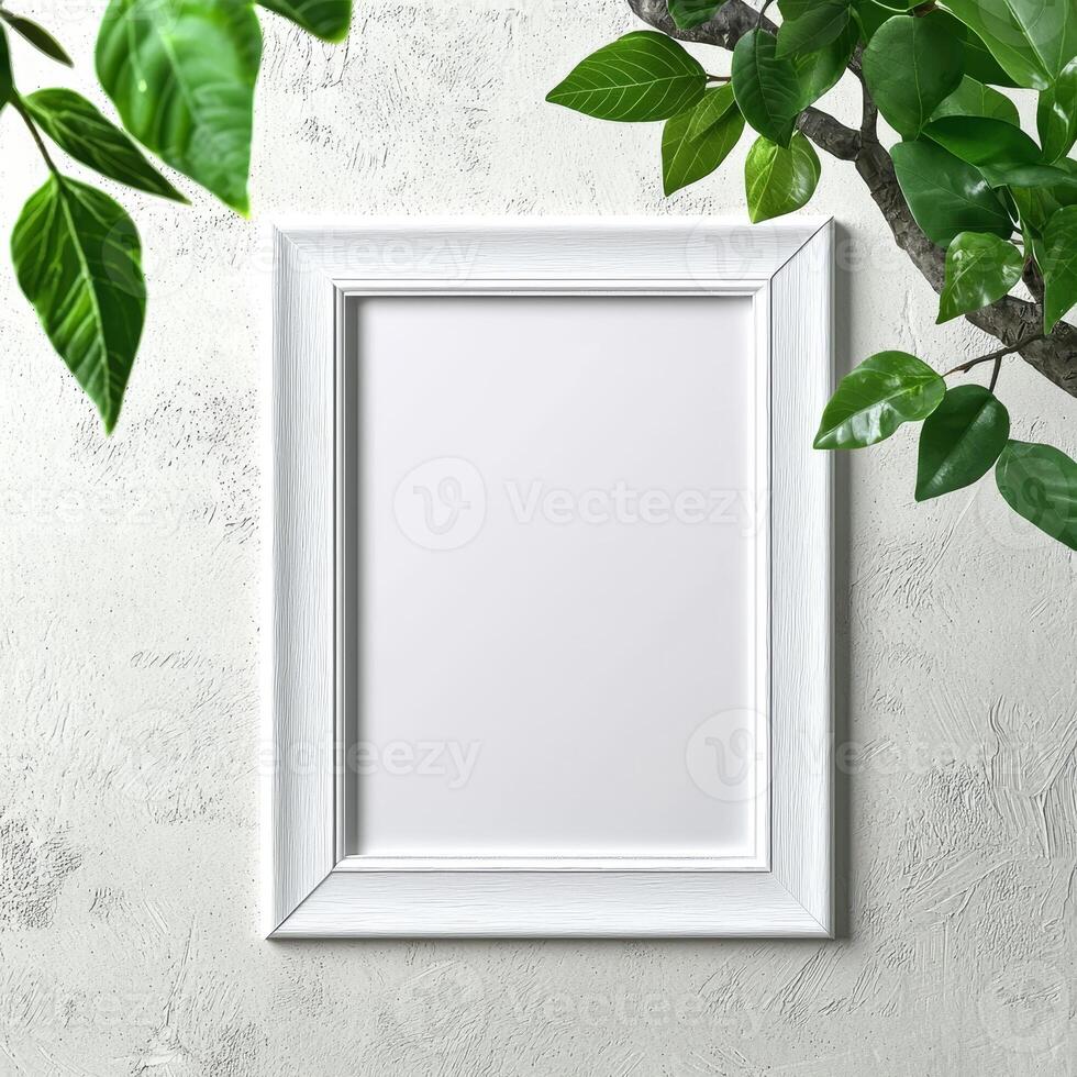Blank white frame with foliage on a textured background. photo