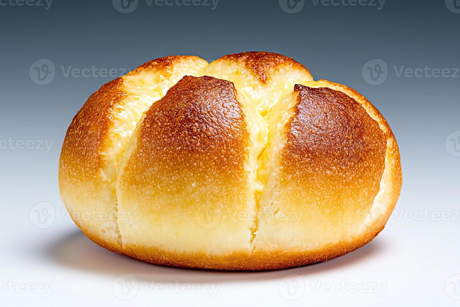 Golden bread roll with a soft texture and crisp surface. photo