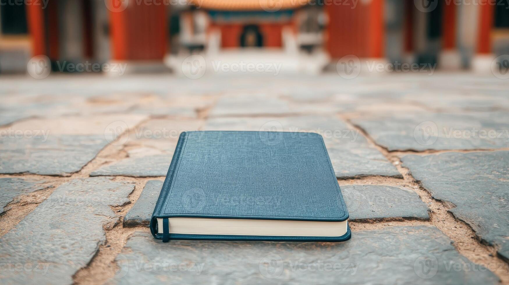 Retired with adventure concept. Leather-bound book on cobblestone path in tranquil setting photo