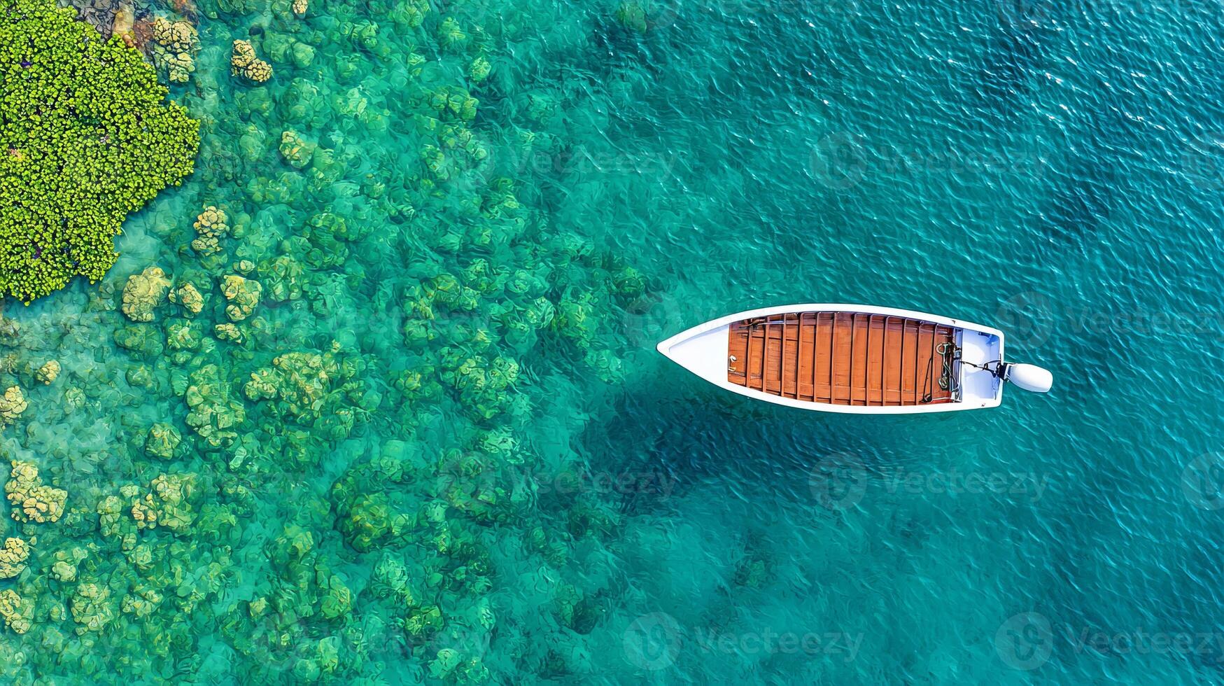 Sustainable management with fisher. Aerial view of a boat navigating clear blue waters with coral reefs. photo