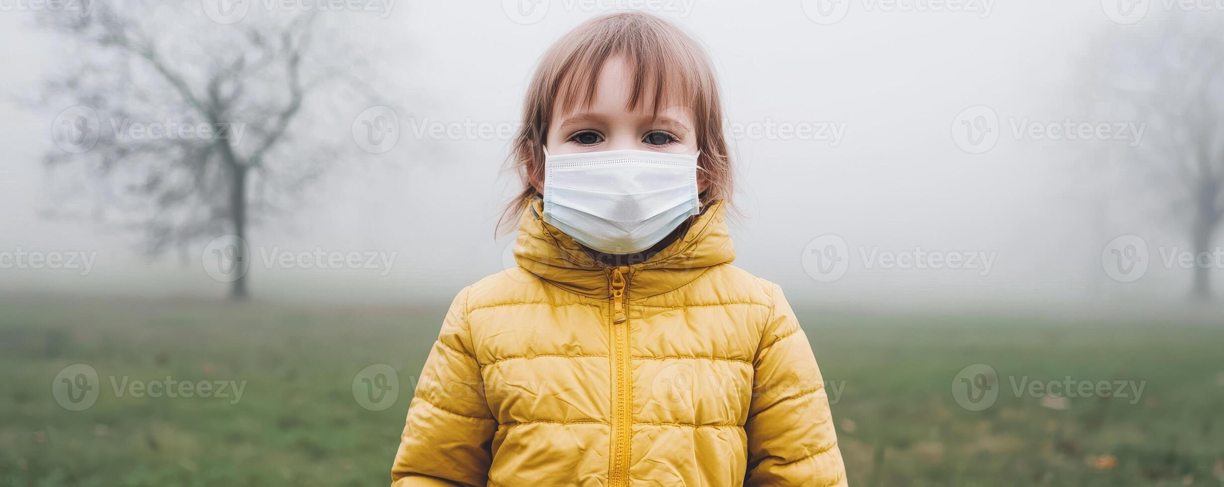 Lung damage causes concept. Child in a mask stands in a foggy field wearing a yellow jacket. photo