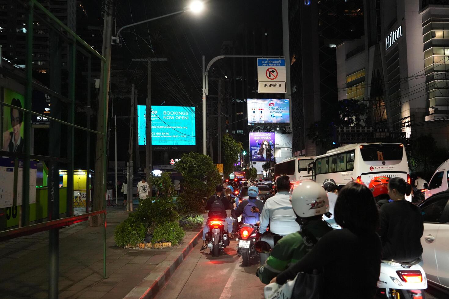 Bangkok, Thailand, 2024 - The atmosphere of the streets at night after it rains. Looks traffic jams on one side of the road. photo
