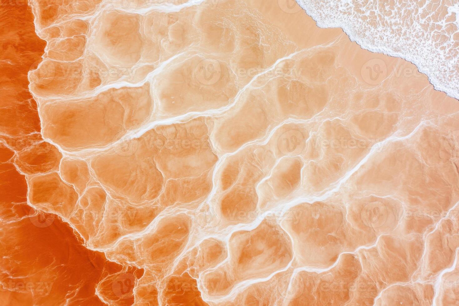 Aerial view of the Namib Deserts golden sands blending seamlessly with the deep blue Atlantic Ocean showcasing striking natural contrasts photo