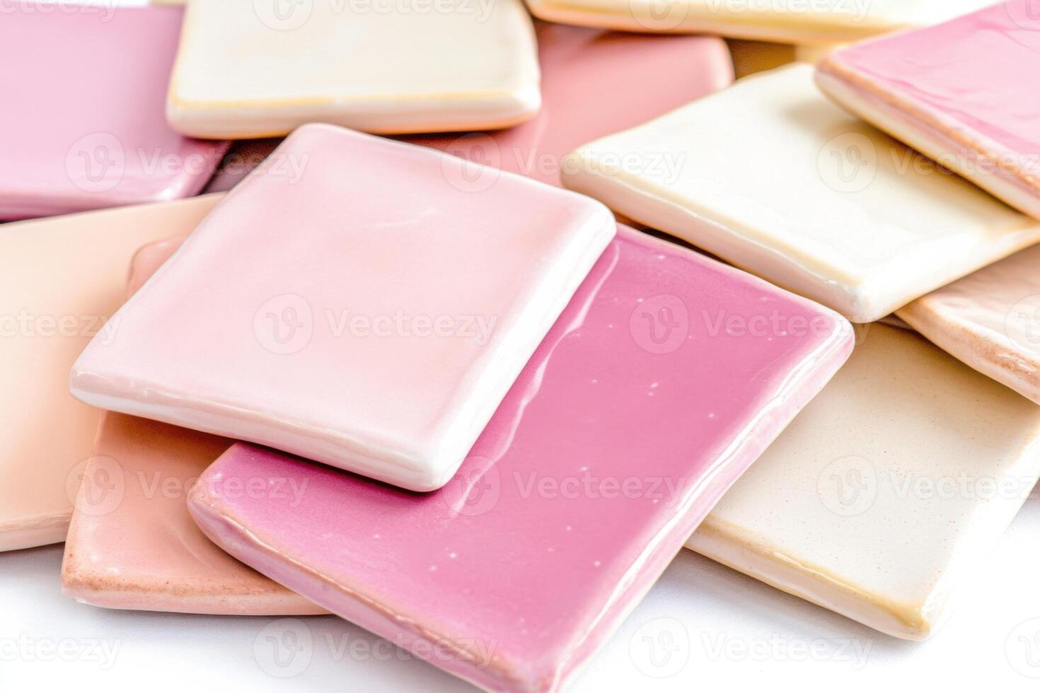 Smooth ceramic tiles in soft pink, dusty rose, and light cream arranged in a geometric pattern for interior design applications photo