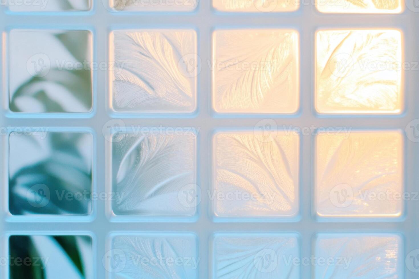 Frosty window patterns illuminated by soft light create a serene atmosphere with delicate textures in pale sky-blue and white-gray hues photo