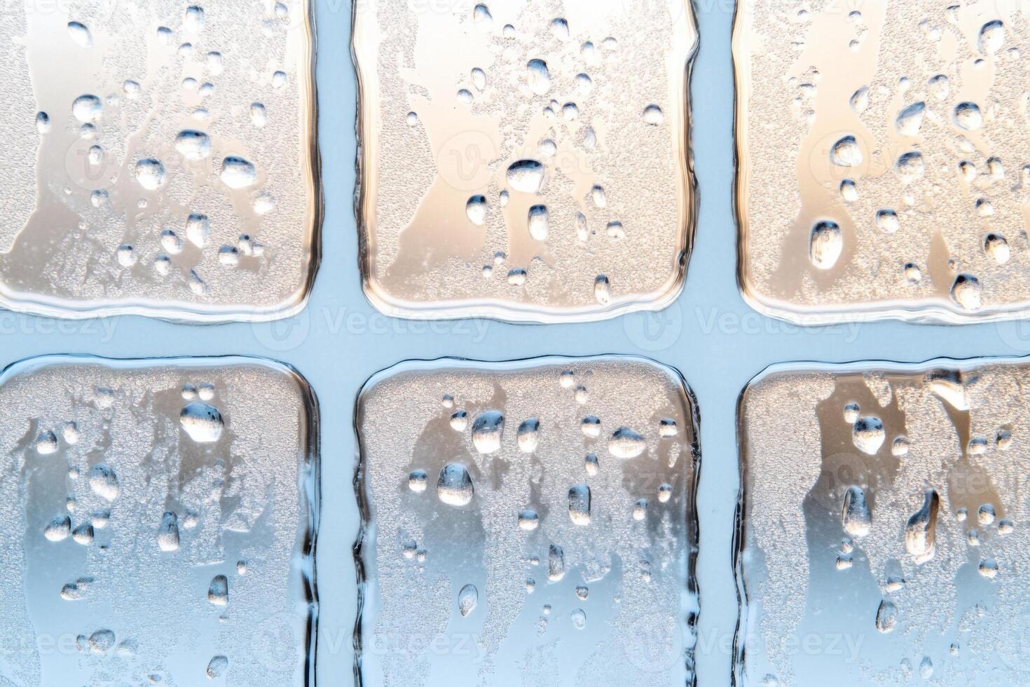 Frosted window patterns create an enchanting view with a pale sky-blue and soft white-gray hue illuminated by gentle light photo