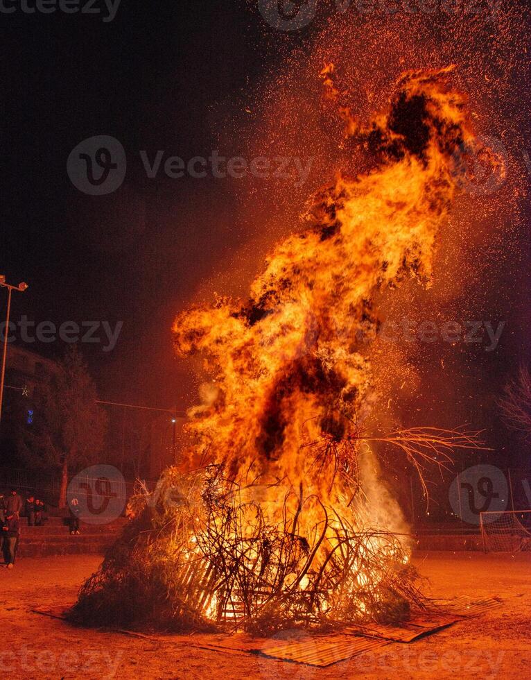 Pile of wood set on fire as a propitiatory act to chase winter photo
