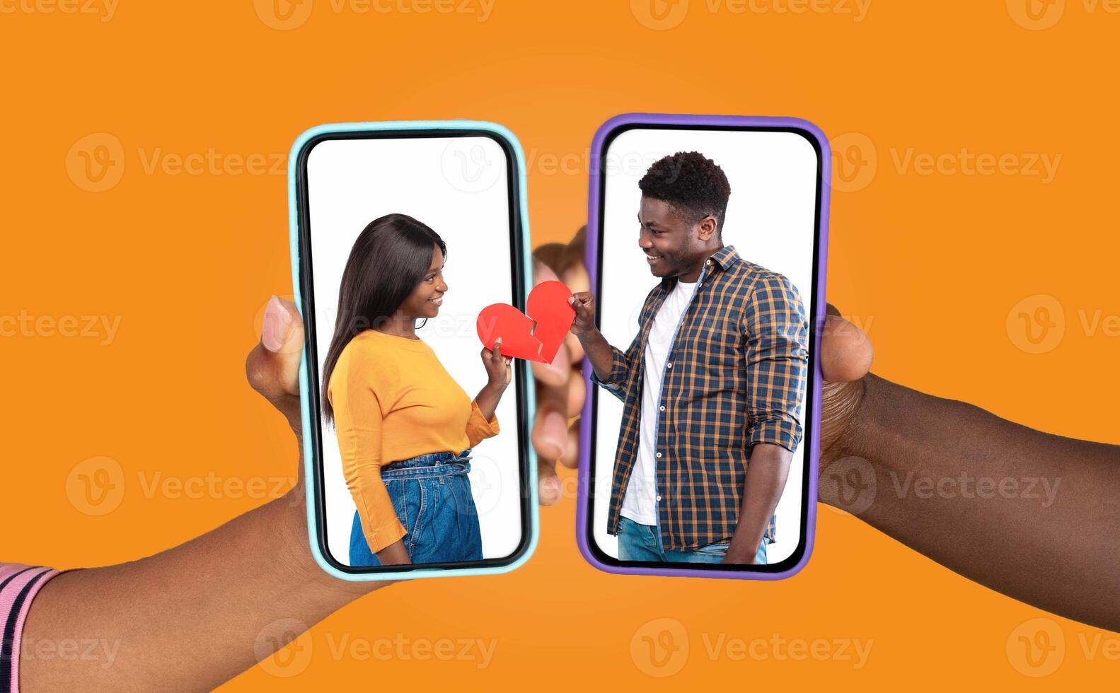 A couple joyfully engages in a chat via their smartphones, each holding a phone with a heart graphic on the screen. The background is bright and playful, reflecting their connection. photo