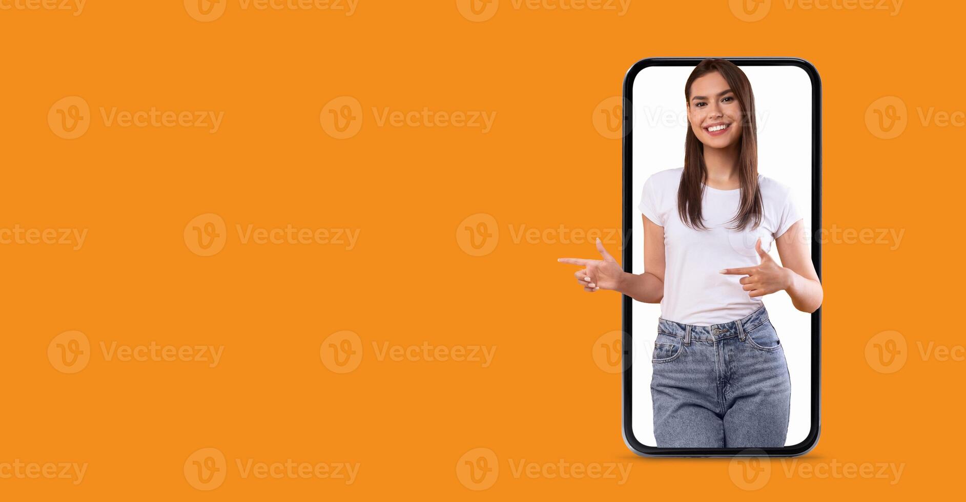 A person with a friendly expression interacts with a large smartphone screen. They are highlighting features related to communication and technology, set against a vibrant background. photo