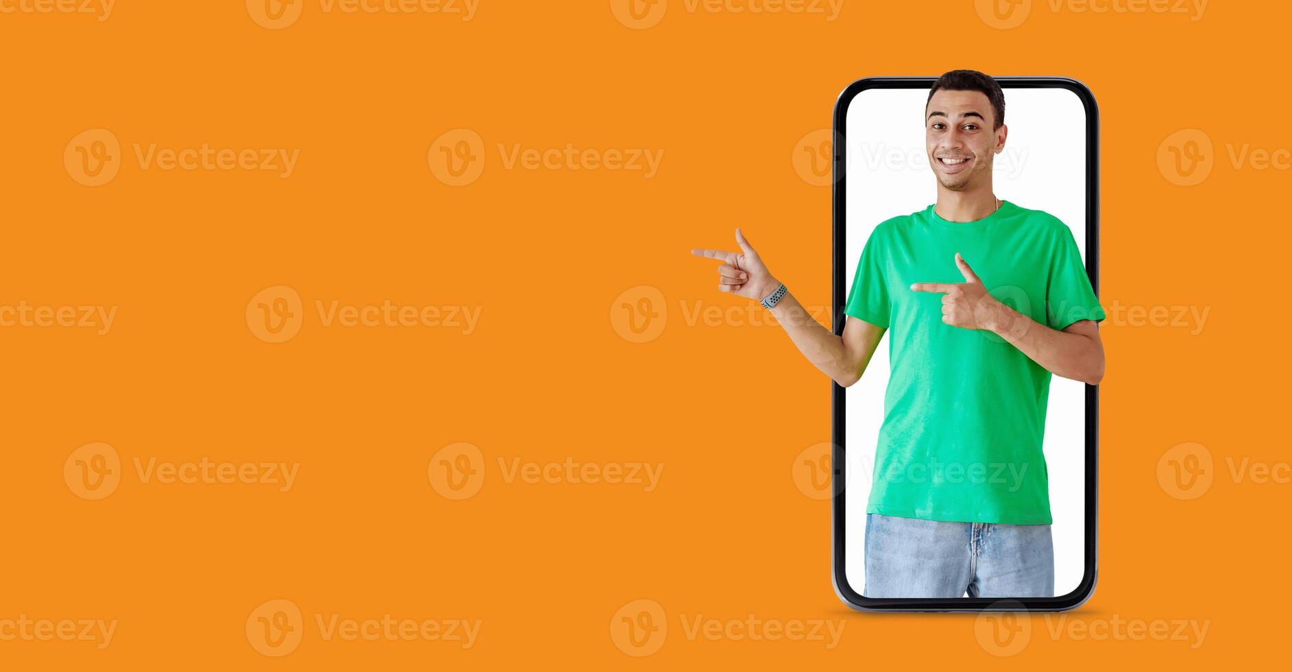 A smiling individual stands in front of a large smartphone screen, gesturing with hands to suggest communication. The background features a vibrant color, enhancing the tech-savvy vibe. photo