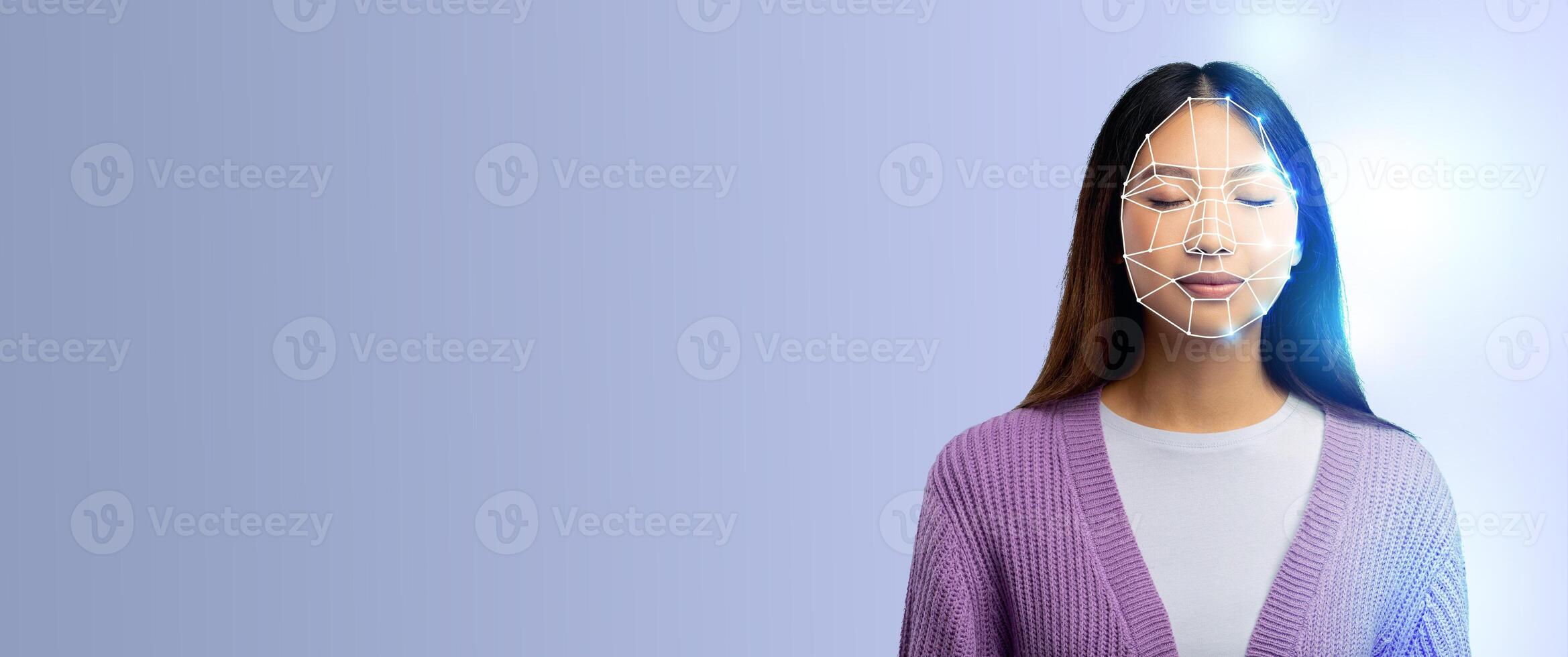 A person with closed eyes appears in a thoughtful pose, featuring a digital facial recognition overlay. The backdrop is minimalistic with a soft blue hue, emphasizing technology. photo