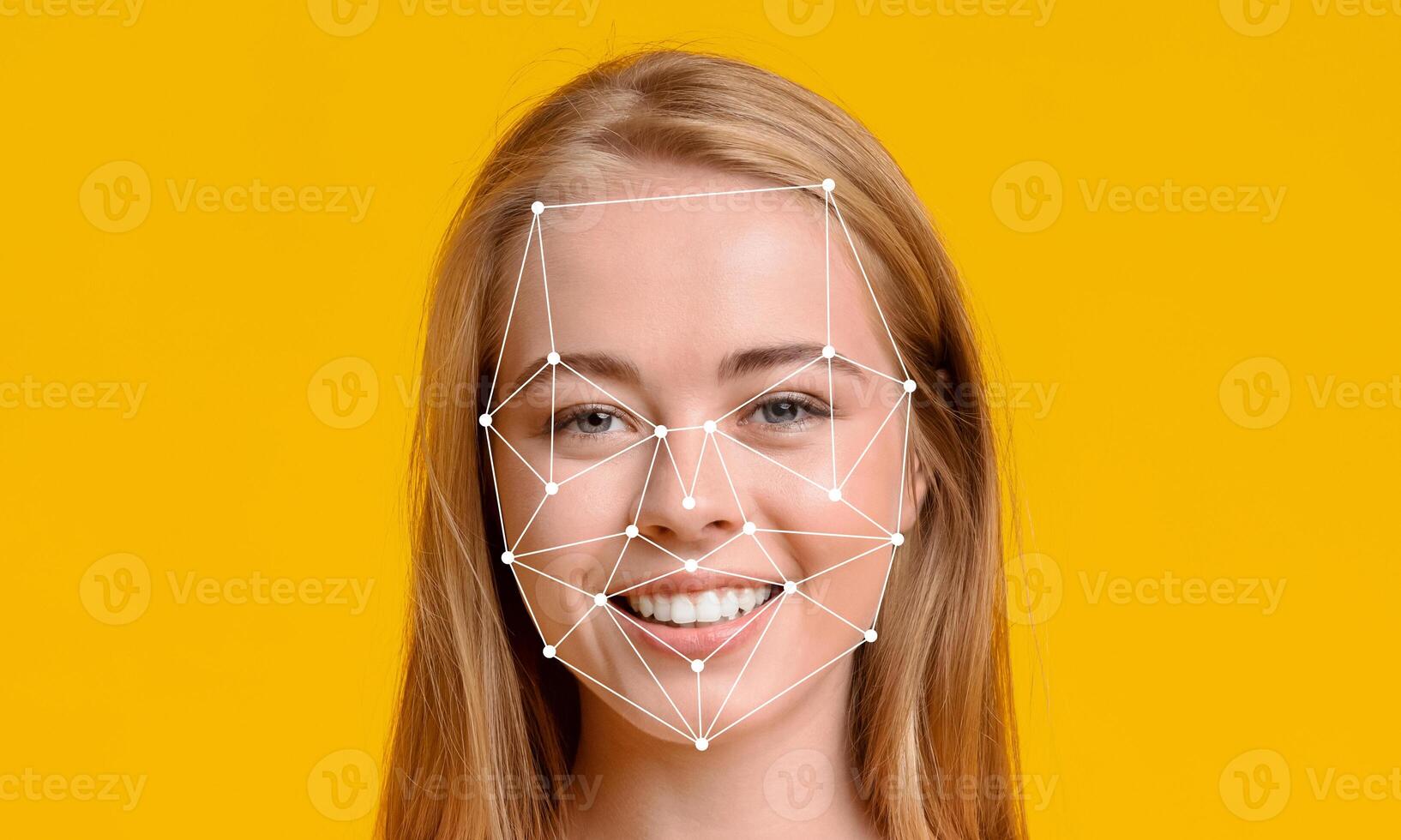 A young woman with long hair smiles confidently against a vibrant yellow background. Her face is overlaid with digital points, demonstrating facial recognition technology. photo
