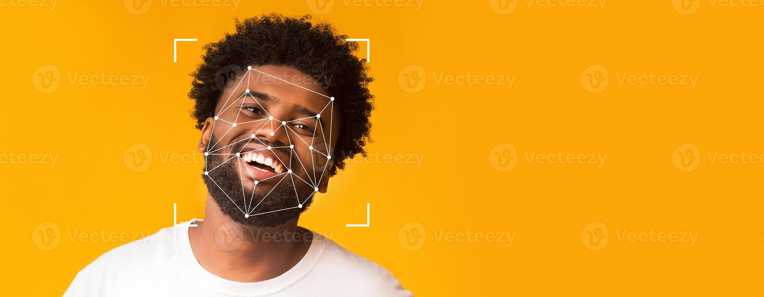 A person with curly hair smiles broadly while facial recognition patterns overlay their face, showcasing advancements in identification technology against a vibrant yellow background. photo