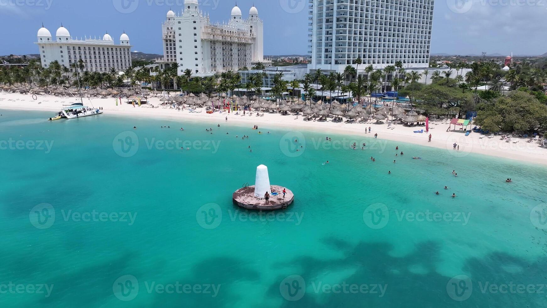 Beauty Palm Beach Lighthouse in Palm Beach Oranjestad Aruba.. Blue Sea Bay. photo