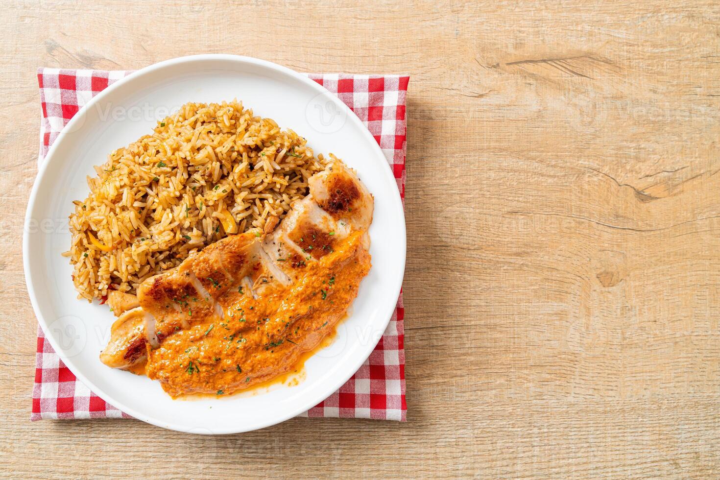 grilled chicken steak with red curry sauce and rice photo