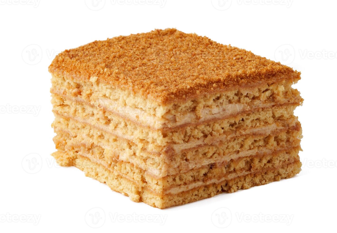 Delicious layered cake with caramel and cream filling served on a plain background photo