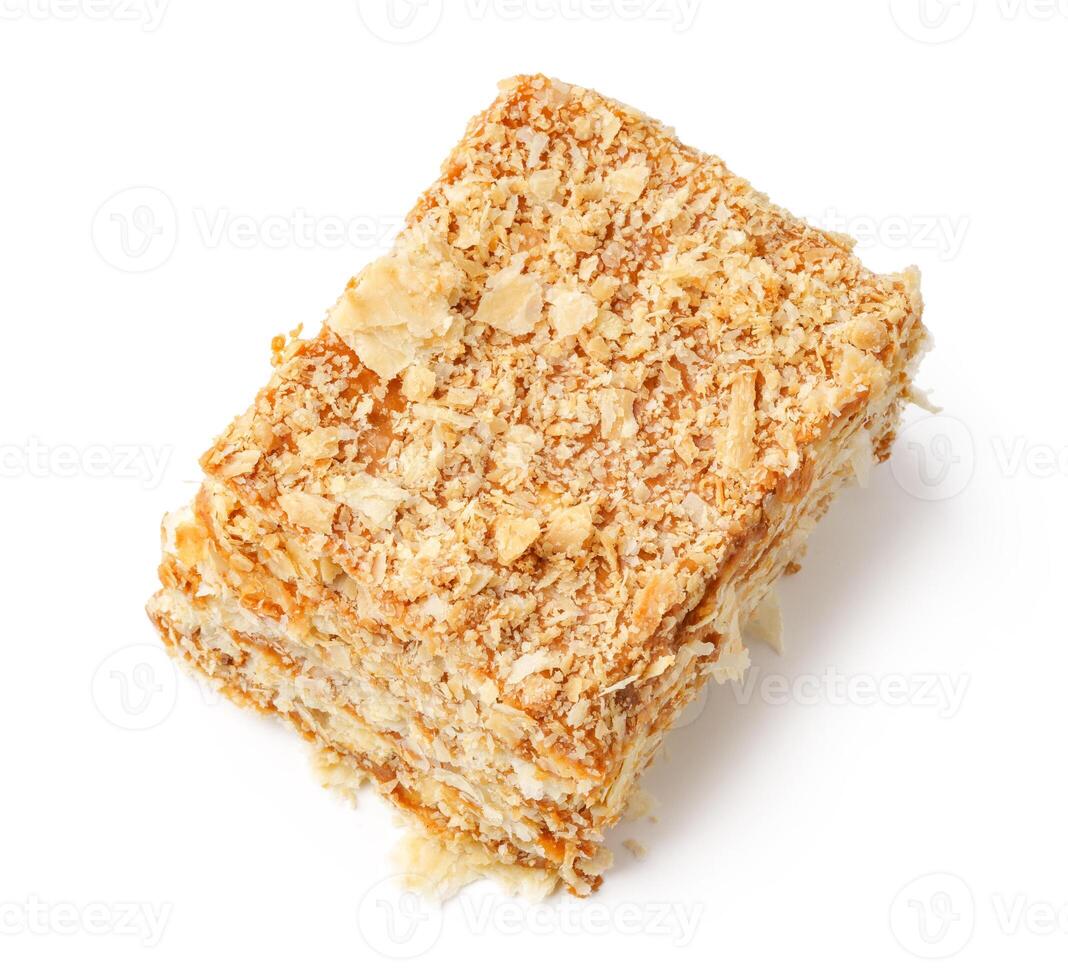 Crunchy dessert treat made from layers of sweetened wheat and coconut served on a plain background photo
