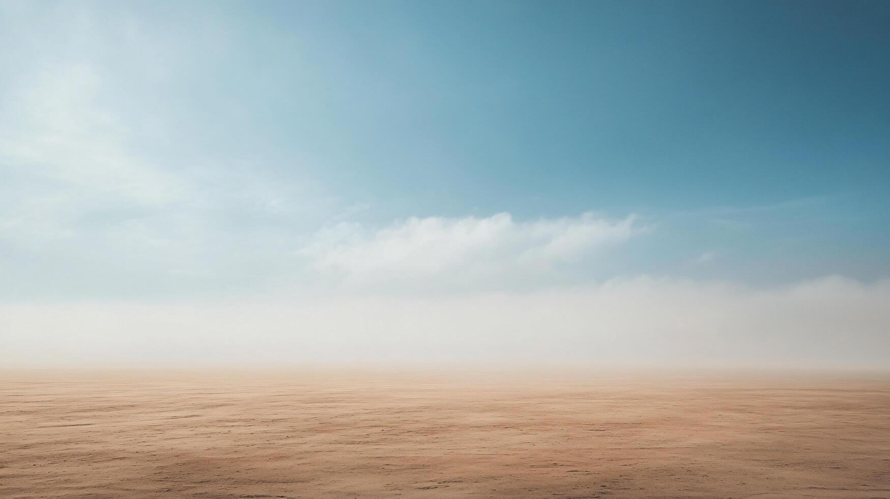 Fog rolling over a flat desert landscape beneath a blue sky with some clouds photo