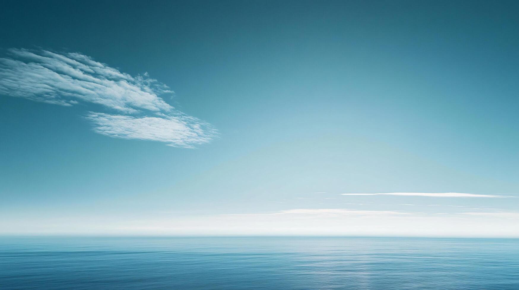 Minimalist seascape with calm ocean reflecting pastel colors under a cloudy sky photo
