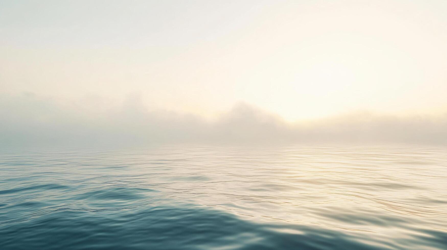 Soft sunlight filters through a blanket of fog over a calm ocean, creating a serene and ethereal atmosphere photo