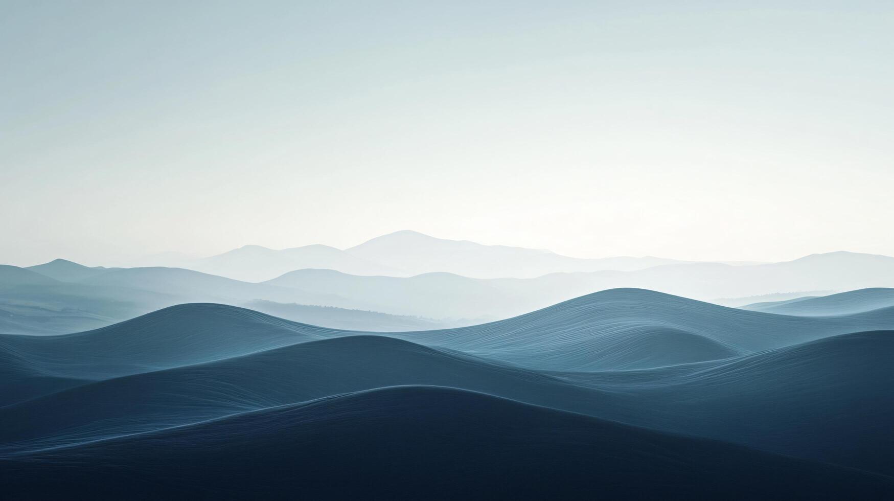Gentle slopes creating a mesmerizing landscape under a pale sky photo
