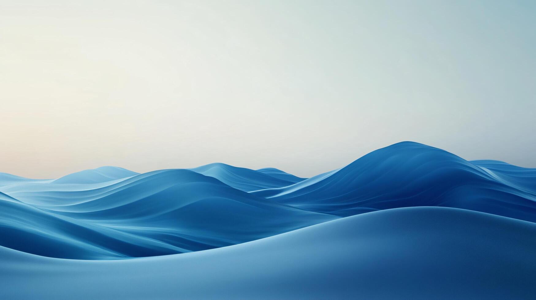 Smooth blue waves forming an abstract and surreal landscape under a clear sky photo
