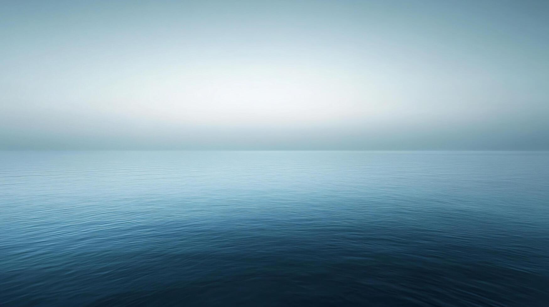Serene seascape with calm ocean water and a foggy horizon creating a peaceful and tranquil atmosphere photo