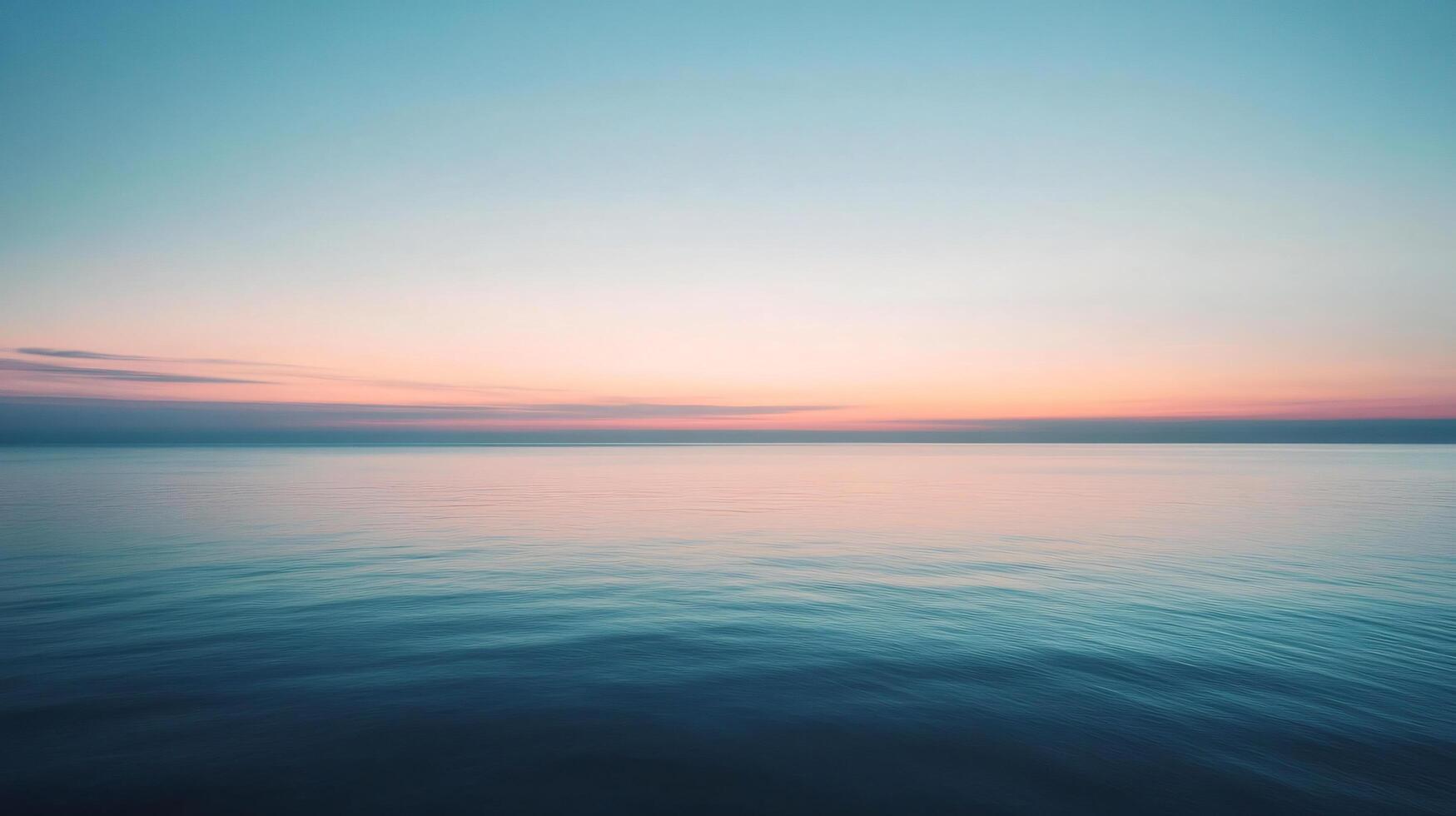 Tranquil ocean reflecting the vibrant colors of sunrise, creating a serene and peaceful atmosphere photo