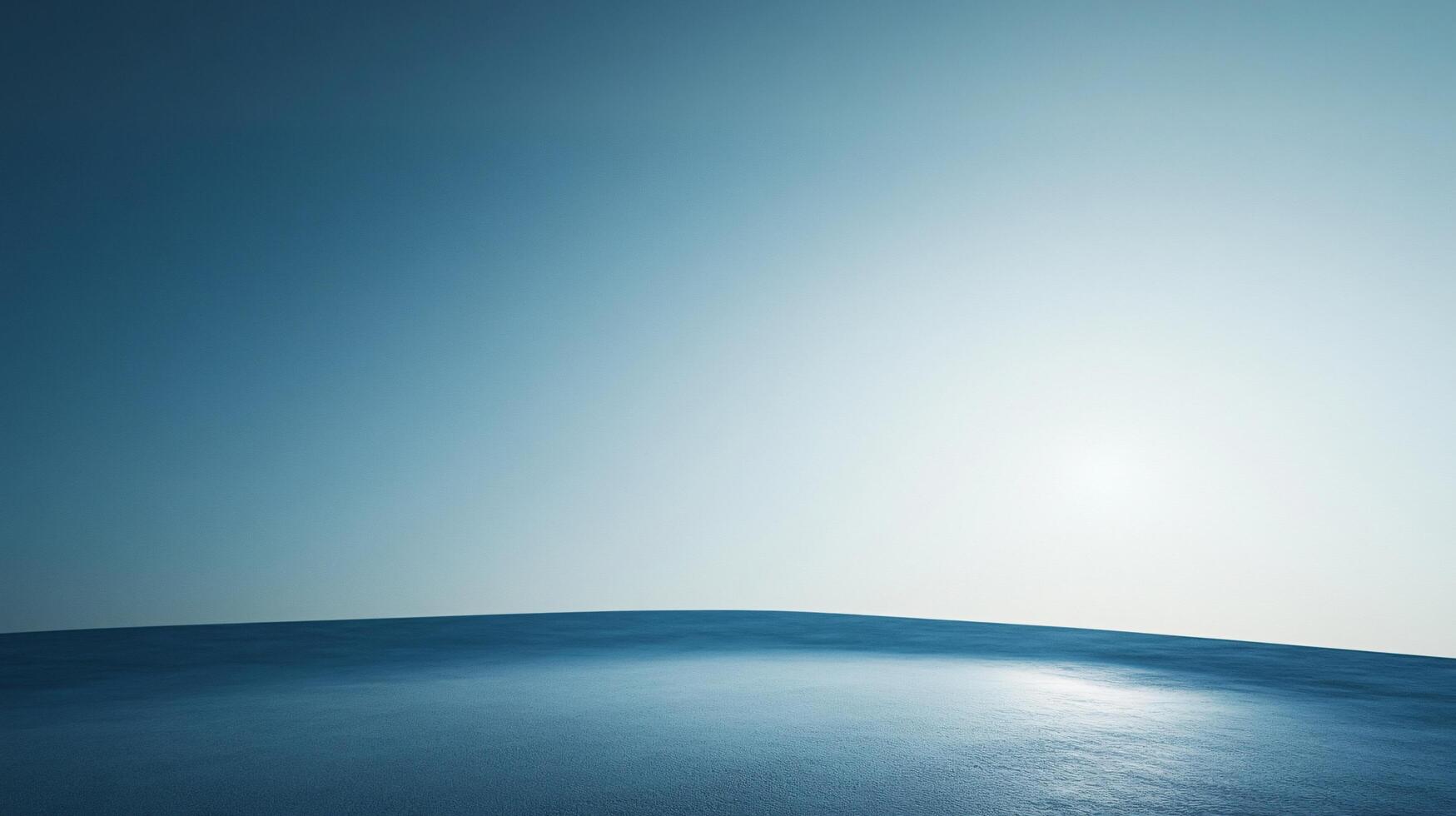 Minimalist landscape featuring a vast, empty space under a clear sky with a bright sun shining over the horizon photo