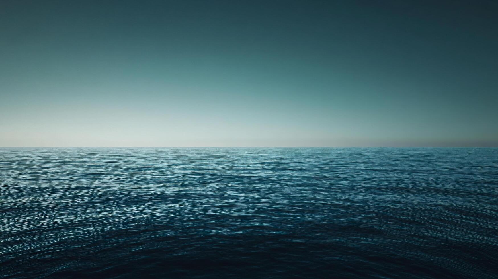 Deep blue ocean meeting a soft gradient sky at twilight, creating a tranquil and minimalist seascape photo