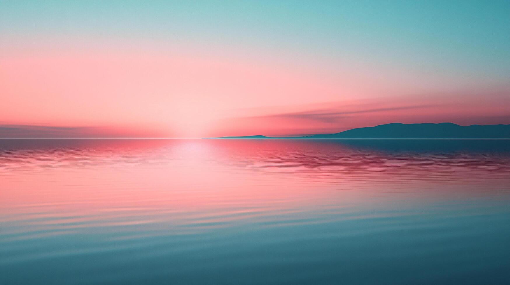 Tranquil sunset scene with pink and turquoise hues reflected on calm water, mountains visible in background photo