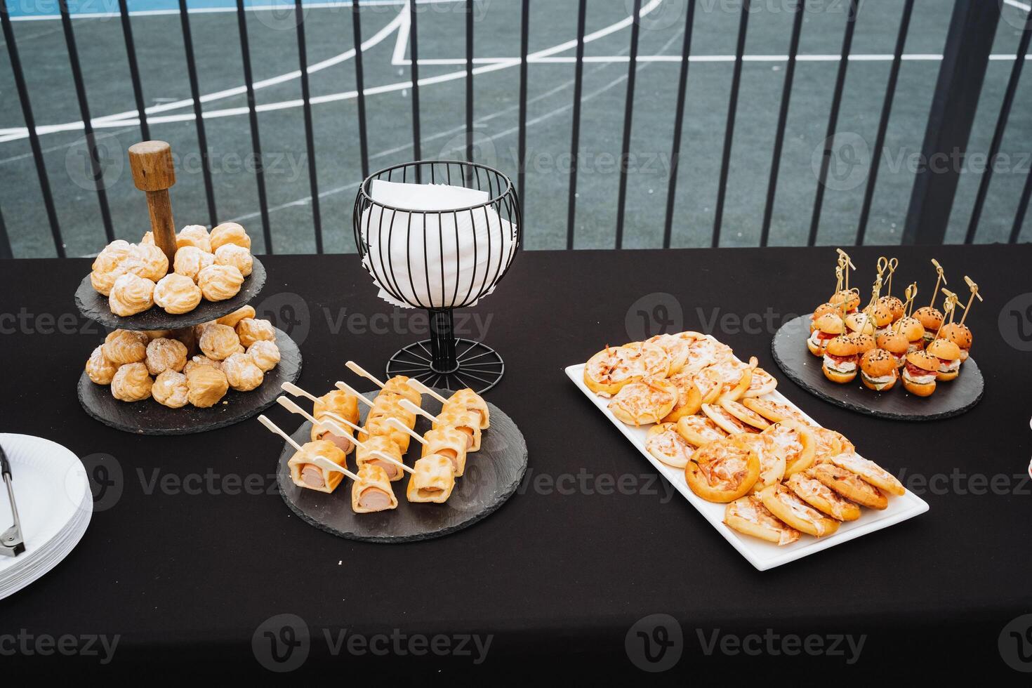 On the beautifully set dining table, youll discover an enticing array of delicious dishes, each showcasing unique flavors and diverse ingredients for everyone to savor and enjoy together photo