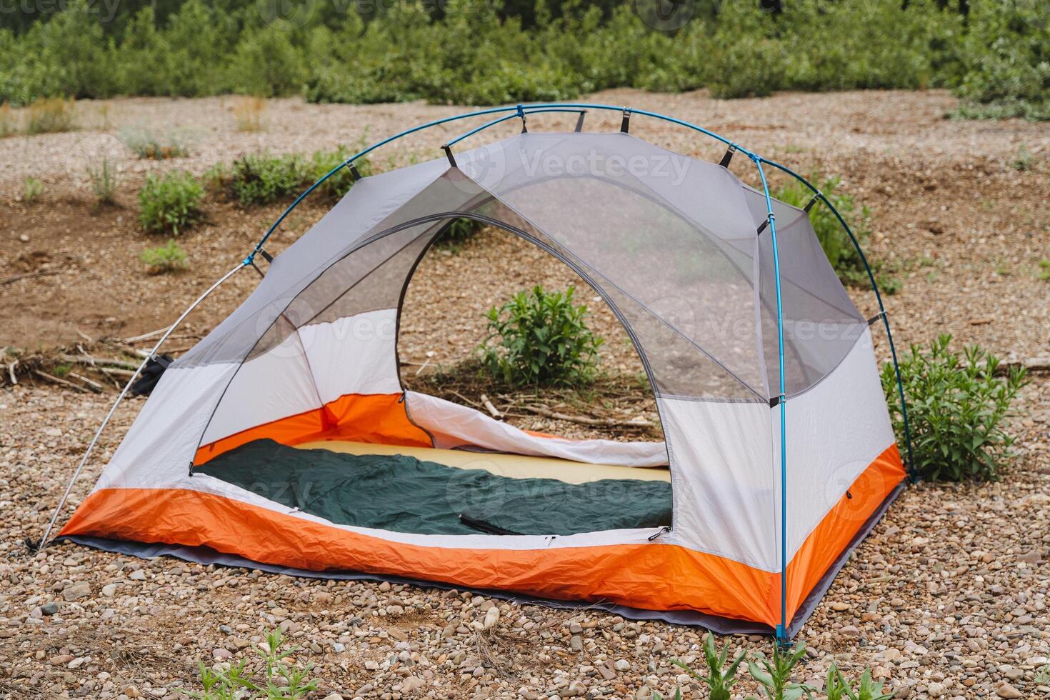 Immerse yourself in nature by camping in a colorful tent perfect for adventure lovers seeking a deep connection with the wilderness and a peaceful escape into the outdoors photo