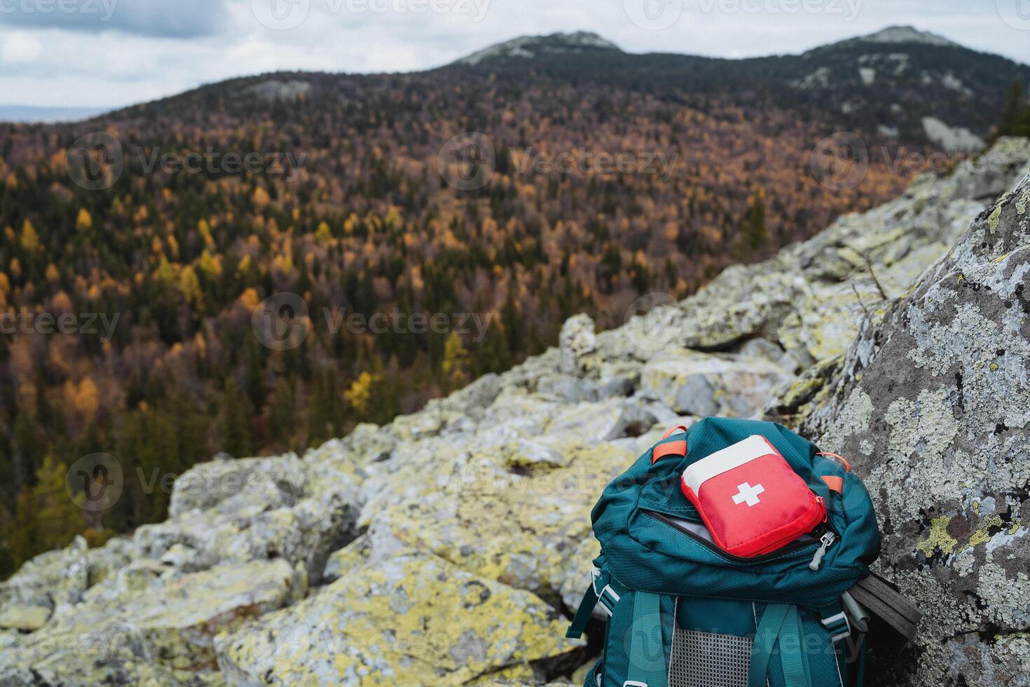 A first aid kit, a red medicine bag, a hiking set of medicines, a first aid kit. photo